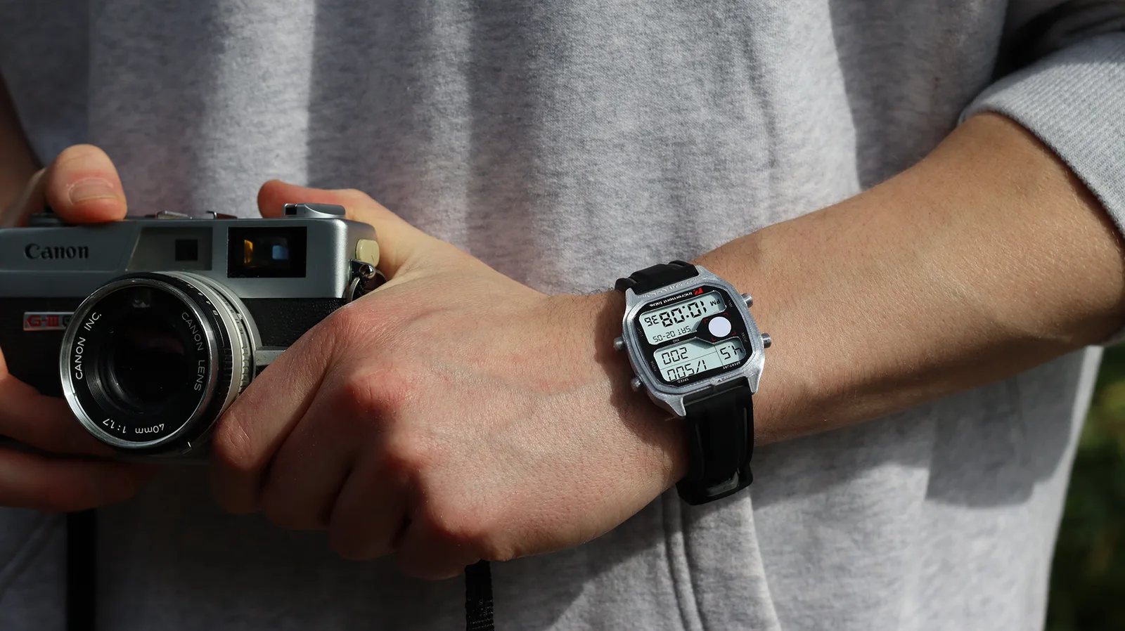 The Increment Labs LMW-V1 Light Meter Watch worn on a wrist, its display showing an exposure reading