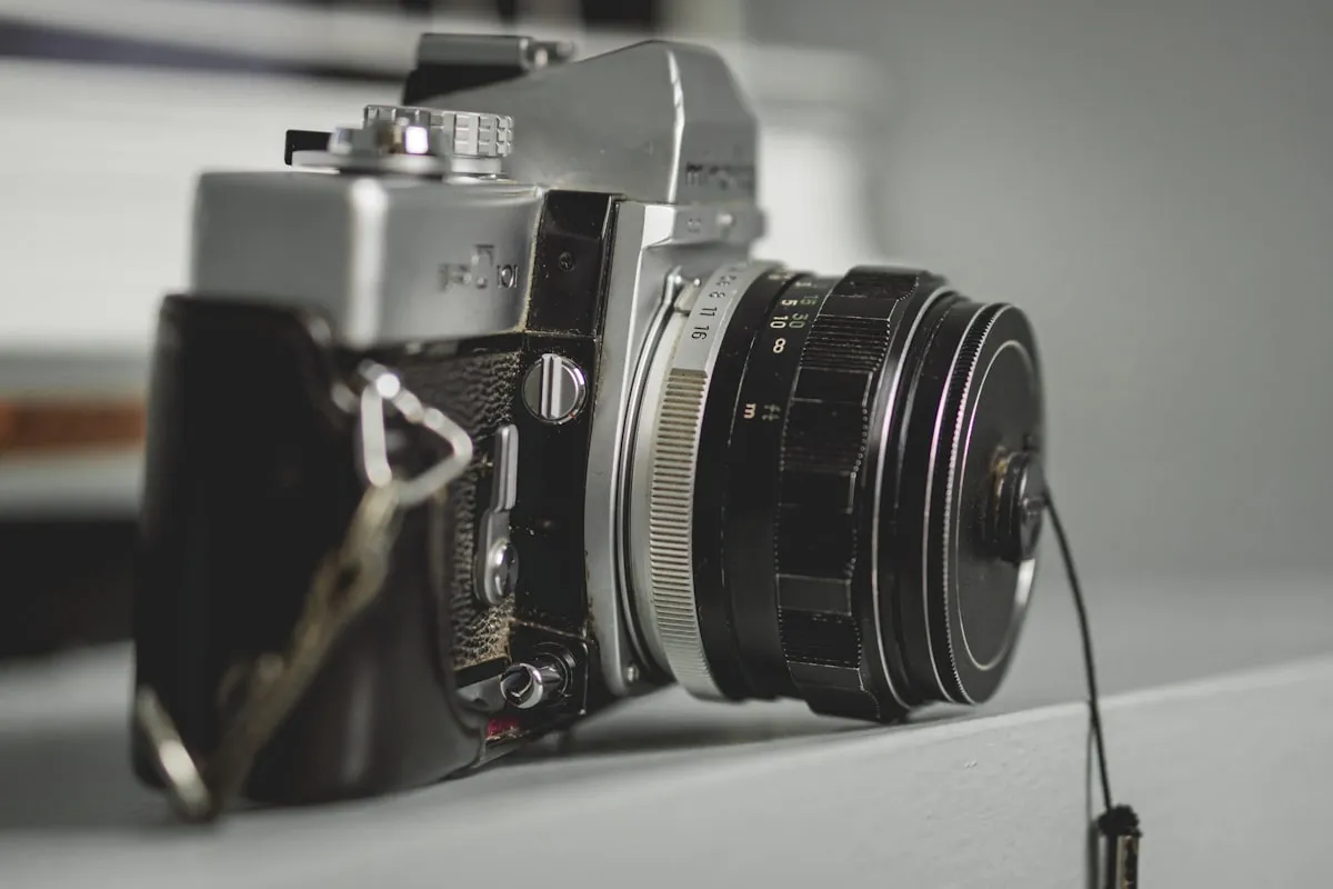 Film camera with lens on a flat surface